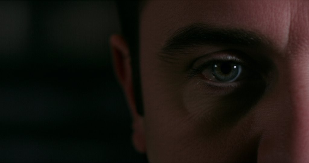 Surveillance eye in shadow